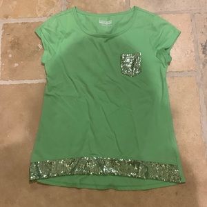 A cute green top in the brand basic editions